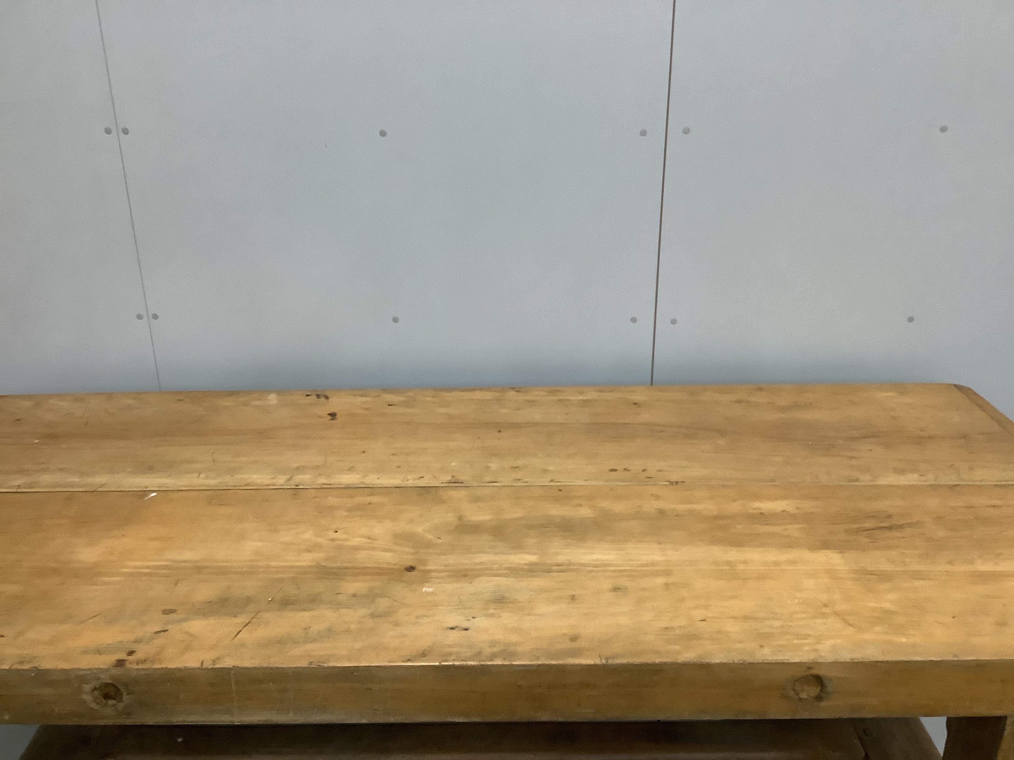 An early 20th century rectangular oak and beech kitchen preparation table the 9.5cm thick cleated twin plank top on chamfered square legs, width 231cm, depth 97cm, height 76cm.